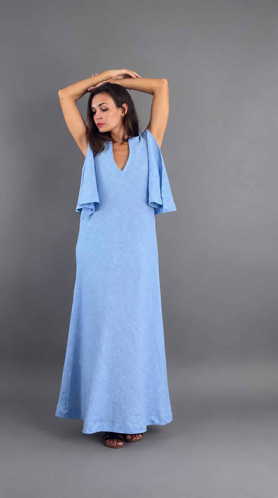 Sky blue Moonlight Elegance maxi dress, model posing with raised arms – Pure Vibe
